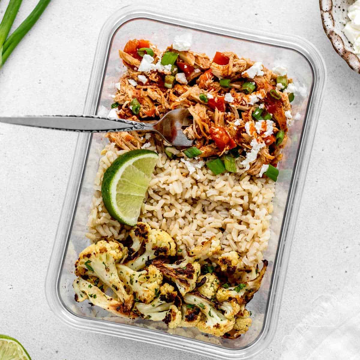 buffalo chicken bowl with brown rice and roasted cauliflower